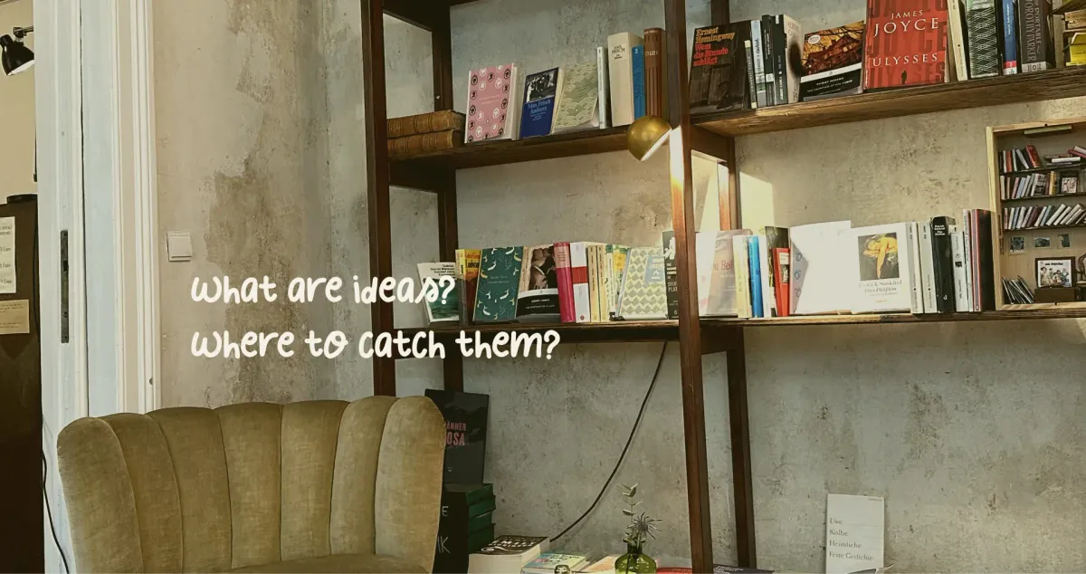 Shelves with books stand against the wall, with the olive green armchair propped against them.